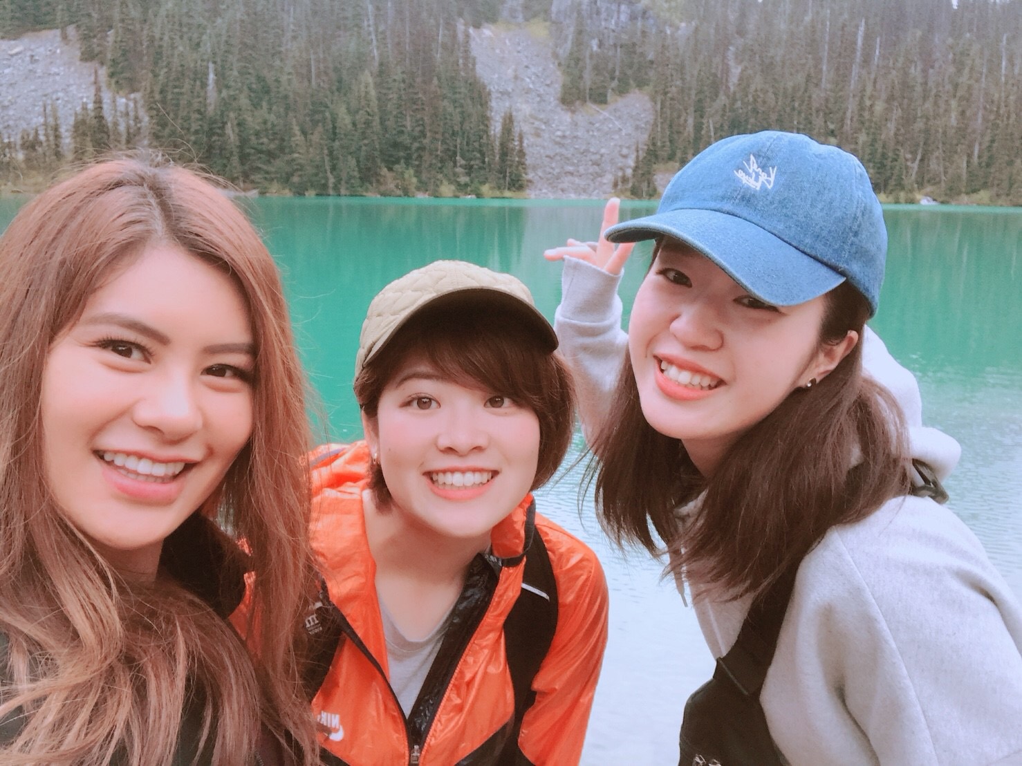 With friends by a turquoise lake